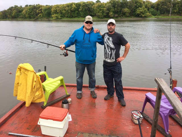 Two men fish on the Red River near Selkirk, Manitoba.